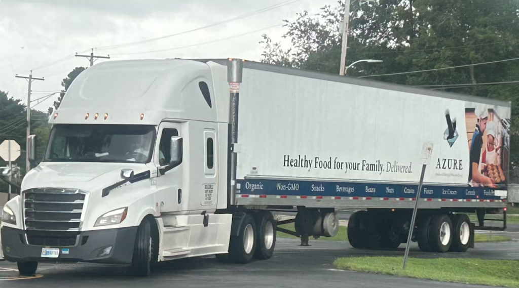 Azure Standard truck pulling into a drop location